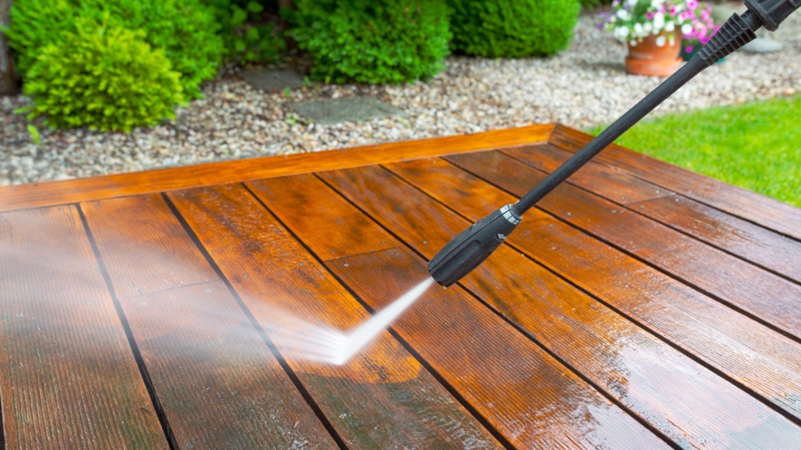 Pressure washing a house exterior