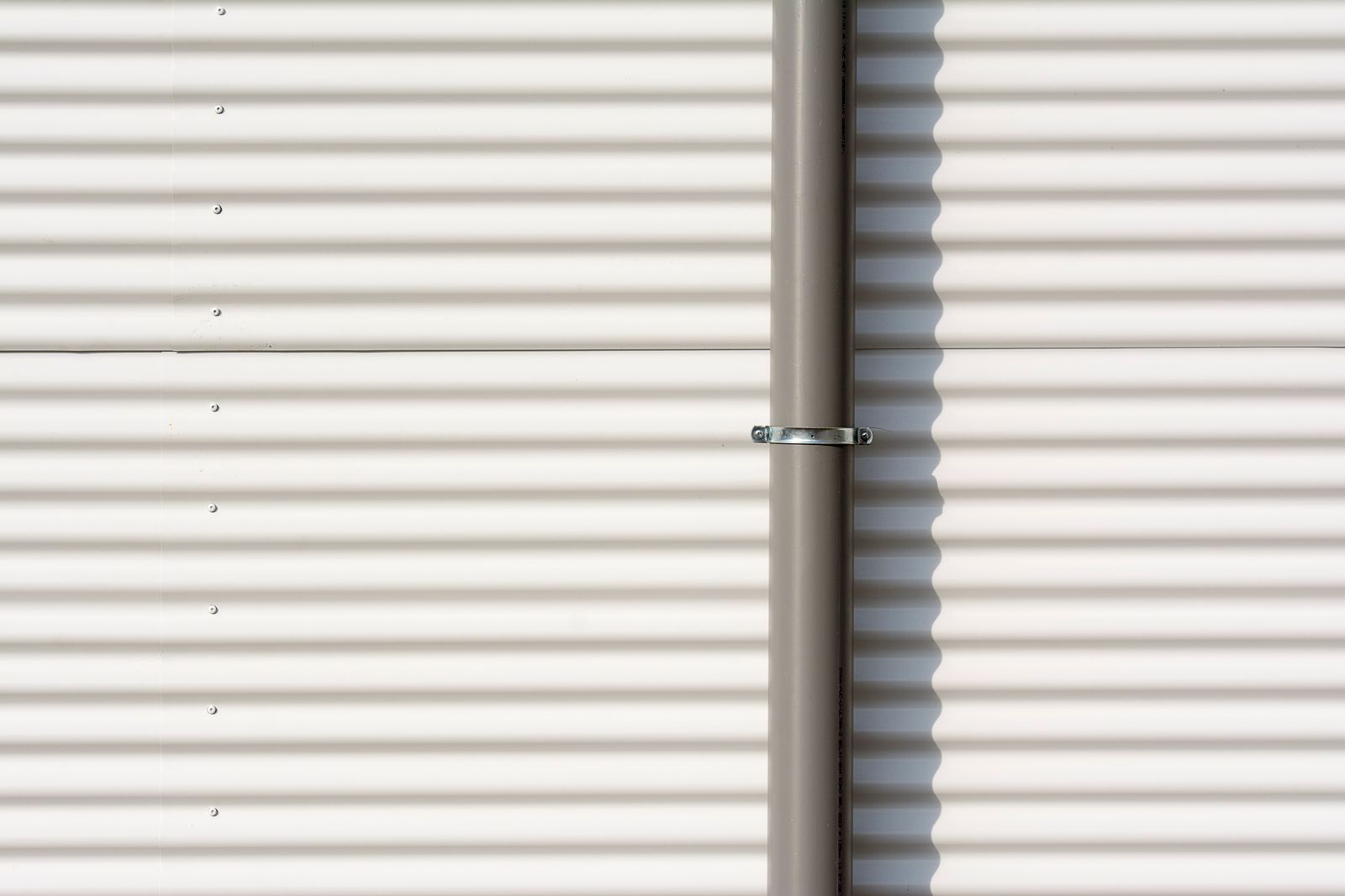 A metal-clad wall in flat light