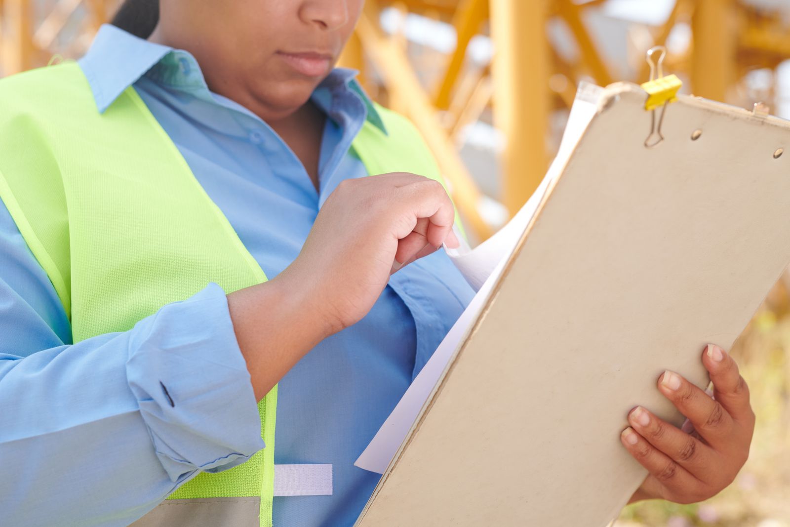 An engineer reviewing drawings on site